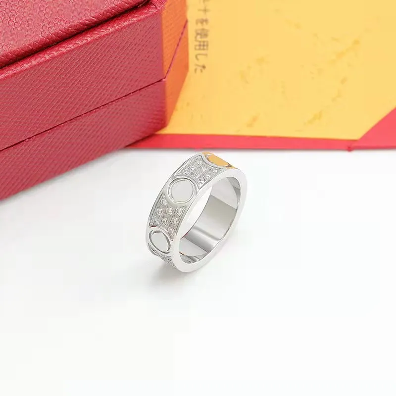 Modna Kobiety Pierłdy ślubne Wysokiej jakości 316L Tytanium Steel Biżuteria Europejska Nowa miłość diamentowe pierścienie 223s