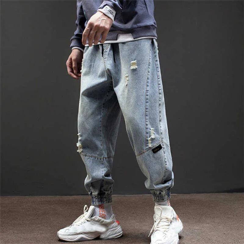 Hip-hop stil harem byxor män 2020 lösa jeans homme rippade frayed denim tvättade jeans streetwear utomhus fritid komfort sarouel x0621