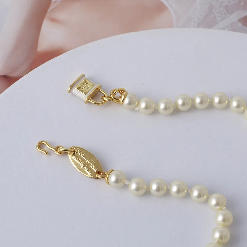 Trendowa biżuteria Saturn Pearl z emaliowanym trójzarowym naszyjnikiem dla kobiet2383