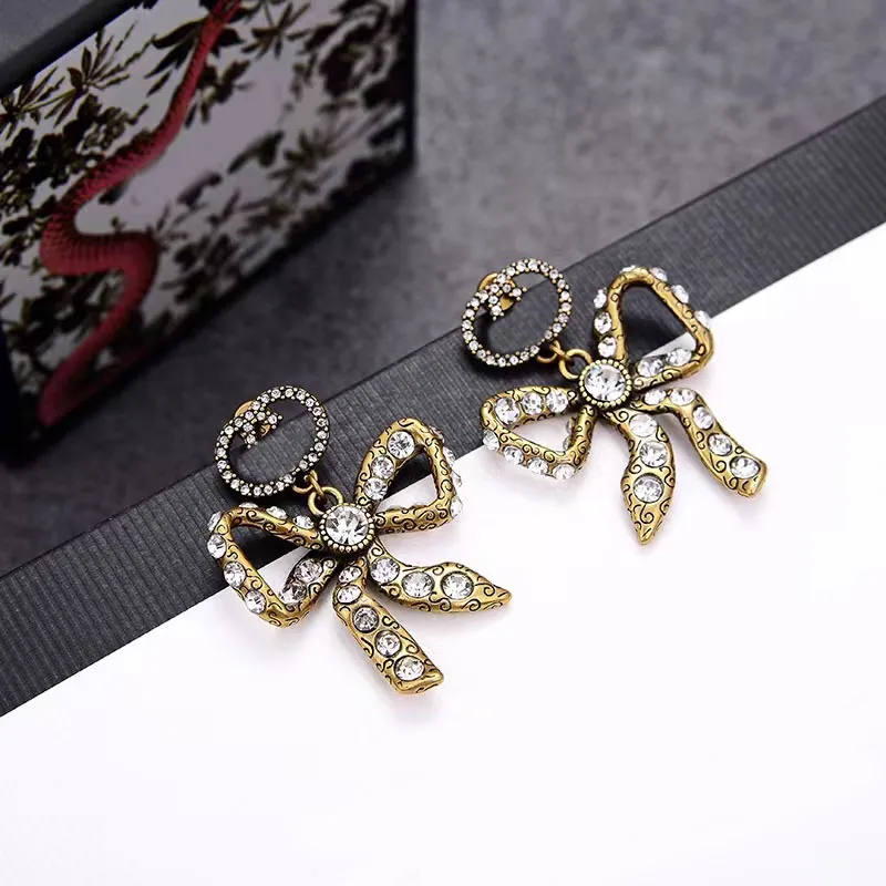 Luxus Designer Mode Charme Ohrring Aretes Messing hochwertige Bogen Ohrringe Damen Party Liebhaber Geschenk Schmuck251Z