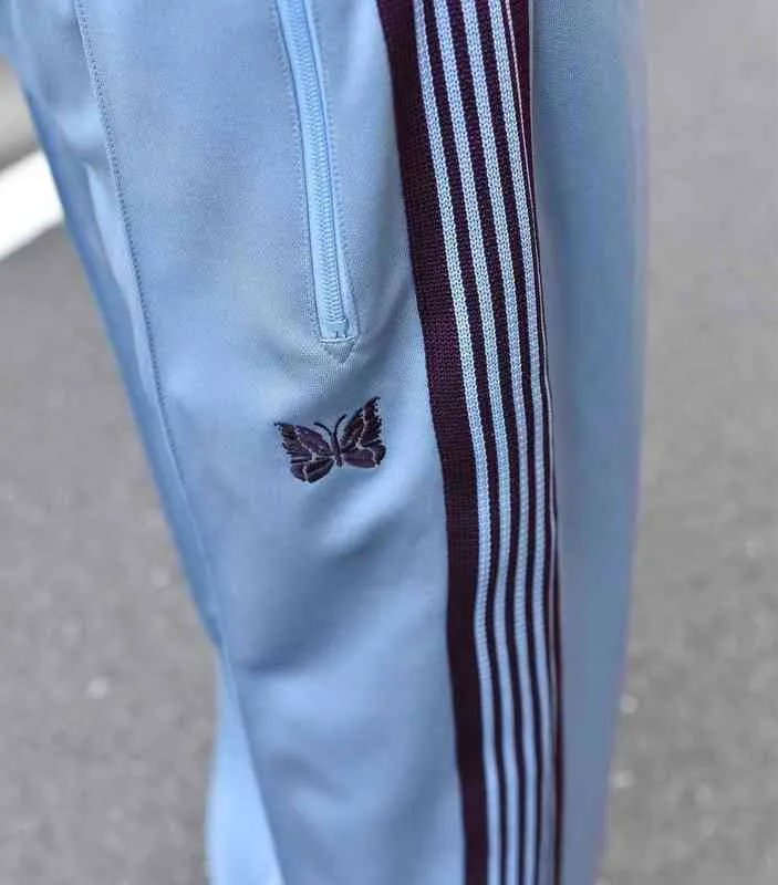 2022 Blue Needles Pants Män Kvinnor Högkvalitativa brunt bandet Stripe Embroidery Butterfly Needles Track Pants Awge Byxor T2208034322886