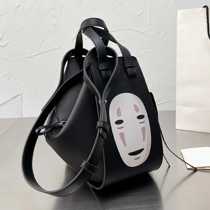 Designer kvinnor väska påsar handväskor kvinnliga ansiktslösa mäns stora kapacitet tecknad spirat bort ryggsäck singel axel väska170p