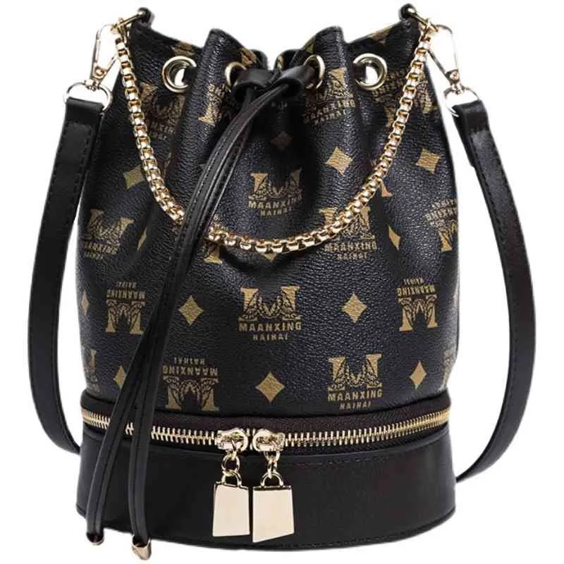 Handväska försäljning väska kvinnlig ny höst version mode hink väska 100 bär ut främmande stil kedja messenger bälte band axelväska