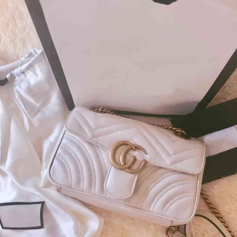 Taschen Kauf einer Damentasche aus echtem Leder, neue Single Shoulder Messenger Bag im kleinen Stil mit Duftkette
