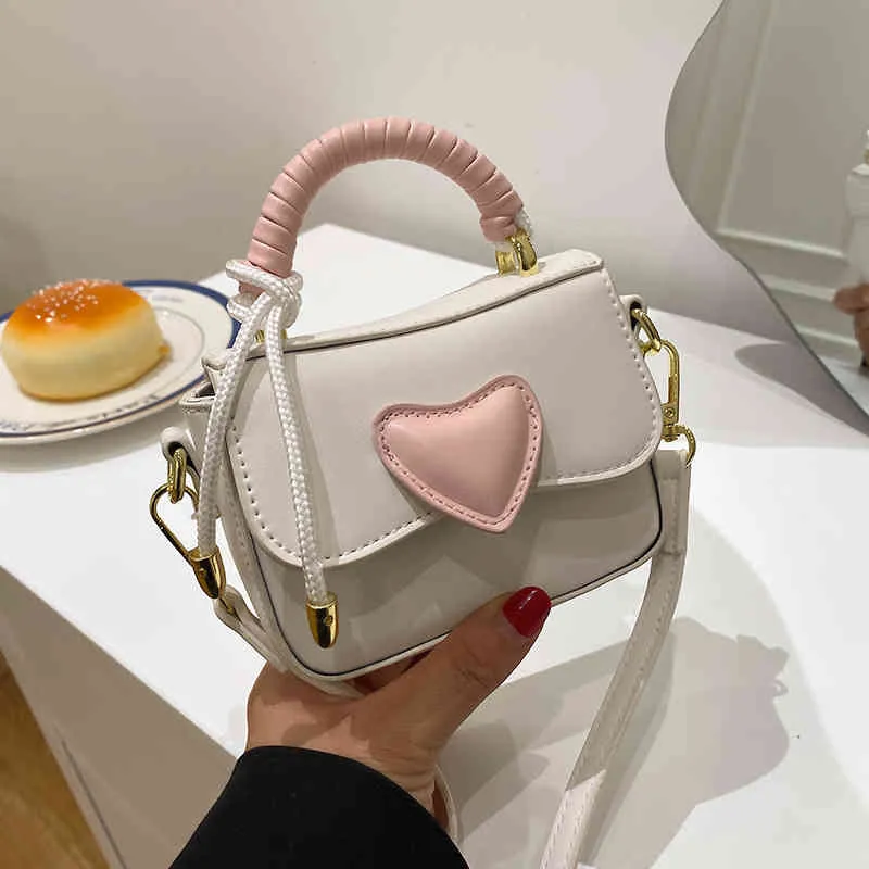 Borse Outlet 2022 primavera nuovo San Valentino amore spalla a mano Borsa a tracolla piccola quadrata in tessuto rosa a contrasto intrecciata da donna