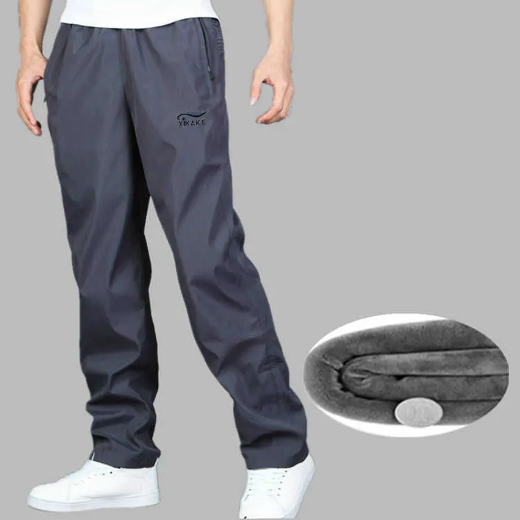 Pantaloni della tuta da uomo Autunno Inverno Plus Pantaloni caldi in velluto Pantalone impermeabile resistente all'usura allentato ad asciugatura rapida 220325