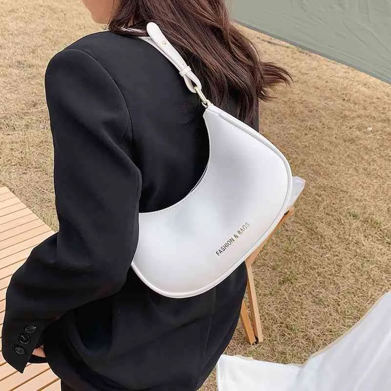 Ny mångsidig en axel armpit väska Messenger Bag mjukt läder dumpling väska mobiltelefon