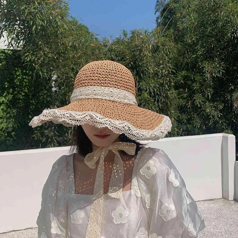 Cappello estivo da spiaggia in pizzo di paglia da donna coreano antivento in corda da viaggio a tesa larga da sole elegante cappello da pescatore Lolita le vacanze