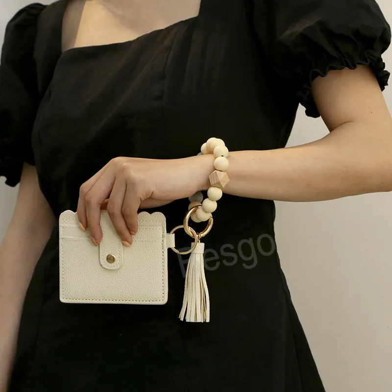 Portefeuille de téléphone portable en cuir pour femmes avec bracelet à pompon Cartes de nom Sacs de rangement de crédit Sac de porte-clés en perles de silicone BH6284 TYJ