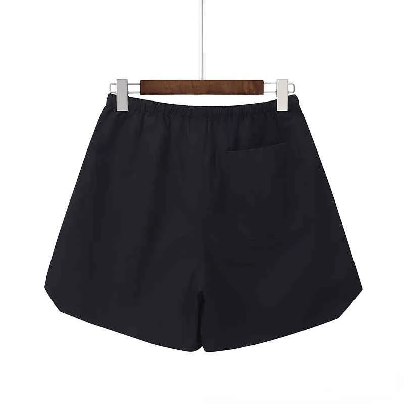 short de couple high street nylon réfléchissant cordon de serrage sensation décontractée Les styles de créateurs de mode peuvent être portés par les hommes et les femmes