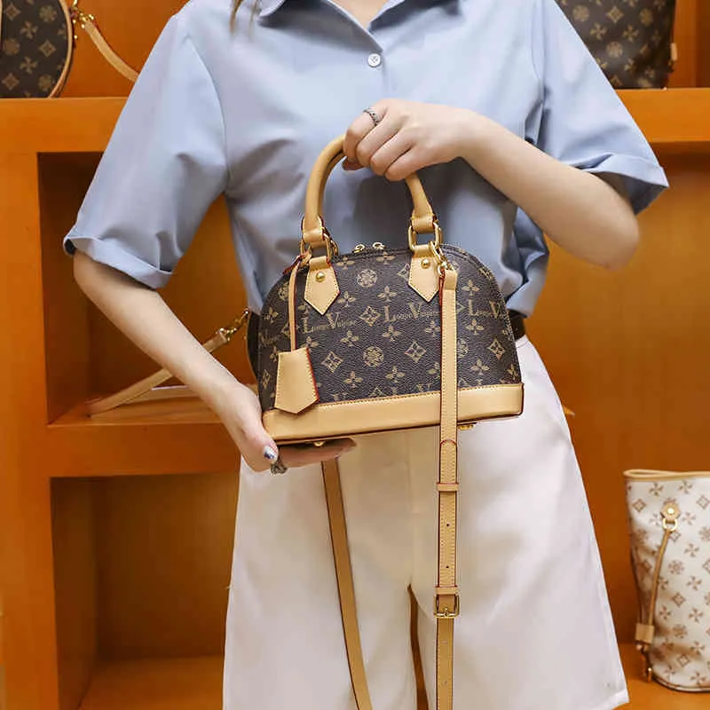 숙녀 패션 럭셔리 브랜드 조수 가방 도매 그물 여성의 새로운 쉘 메신저 다목적 핸드백 단일 어깨