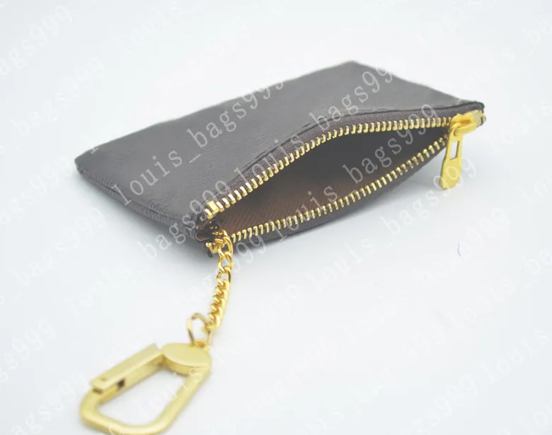 Z pomarańczową skrzynką Kluczową sakiewkę prawdziwą skórę słynne klasyczne designerskie kobiety kluczowy uchwyt na moneta torebka małe skórzane czarne towary Bag267m