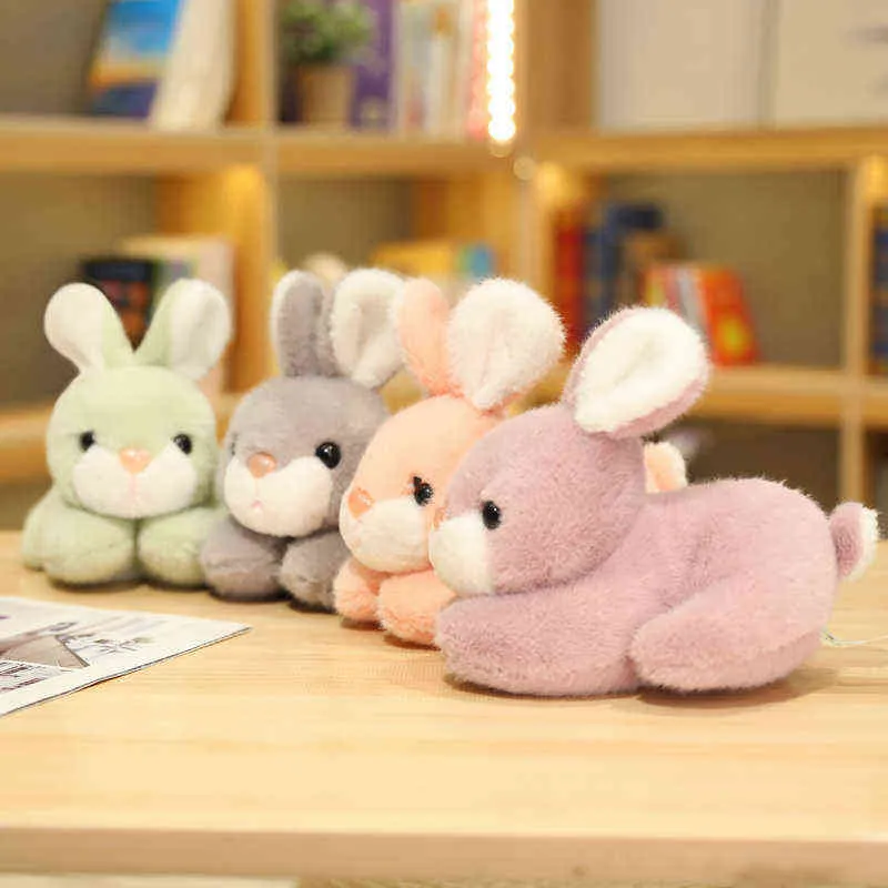 Pc Cm Belle bambole di coniglio di peluche Simpatici conigli sdraiati pieni di giocattoli animali morbidi la decorazione della stanza di casa Regalo di compleanno J220704
