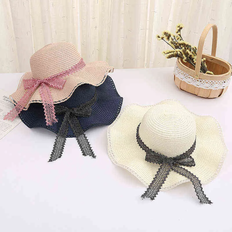 Chapeau de paille de plage d'été dames grand bord pliable arc chapeau de plage 2022 nouvelle femme vacances d'été Panama fille chapeau de soleil en gros G220301