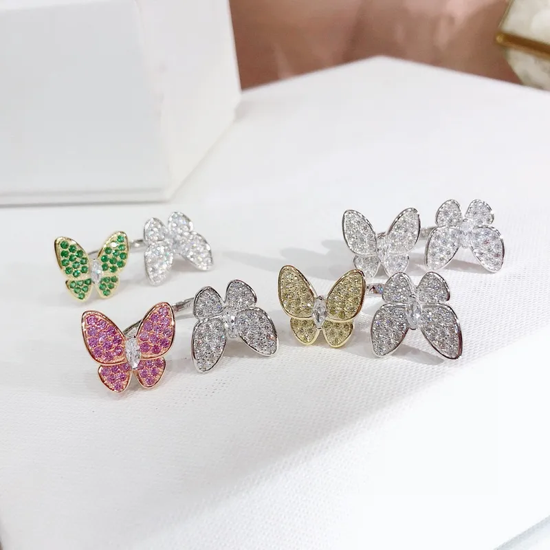 Европа Америка Модные кольца Леди Женщины Латунные оправы Цветной бриллиант Золото 18 карат Две бабочки между пальцами Кольцо 4 цвета250h