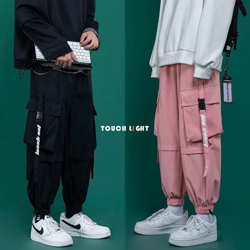 Svarta lastbyxor män s mode lösa tappade casual rosa hiphop sport japanska streetwear svettbyxor 220719