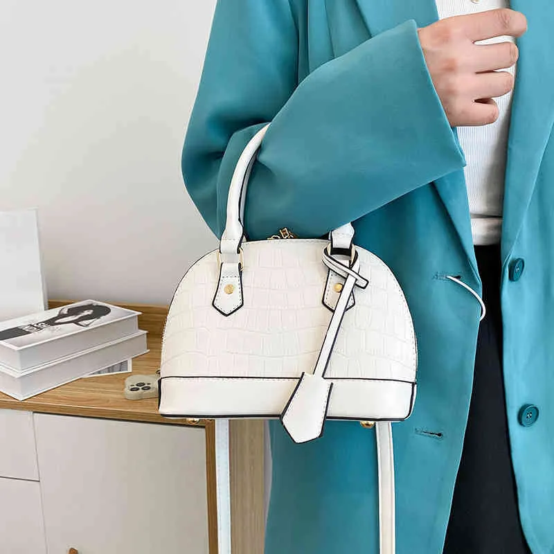 Handtassen 70% korting op patroon draagbare shell tas 2022 Zomer nieuwe eenvoudige stijl sling een schouder damestempelingen