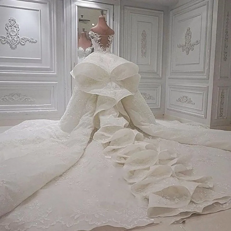 Luxury ruffles sjöjungfru bröllopsklänningar spetsar från axelkapellet brudklänningar med V -hals av löstagbar tåg brud klänning dd
