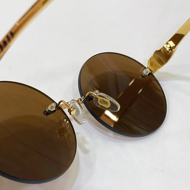 Круглые солнцезащитные очки, дизайнерские мужские безрамные пантеры с рогом буйвола, деловые повседневные женские очки, очки из серебра, золота, металлические спортивные очки Un270k