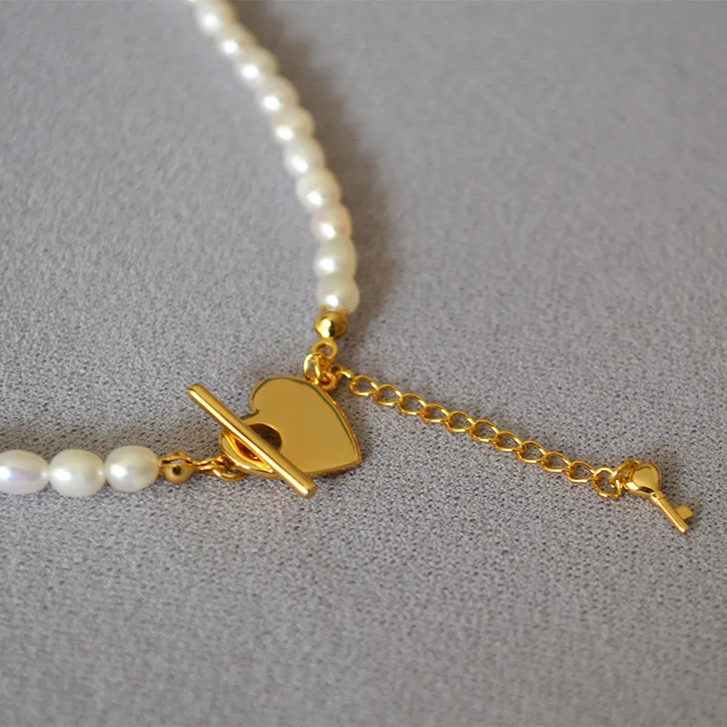 Collane con perle di semi Perle naturali da 4 mm con chiusura a cuore in oro233C