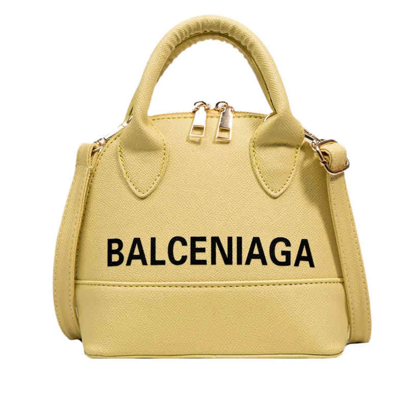 Bolso de mano bolsos de moda Shell para mujer un mensajero portátil pop cargo carta de gran capacidad color caramelo fábrica al por mayor 70% de descuento