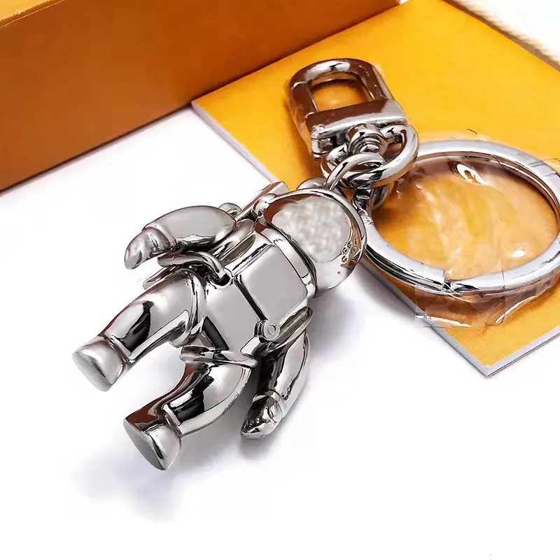 Ashion Nieuwe roestvrijstalen Spaceman Key Ring Luxe ontwerper Keychain Self Defense Hoogwaardige munt Purs Keychain Pendant Access267m