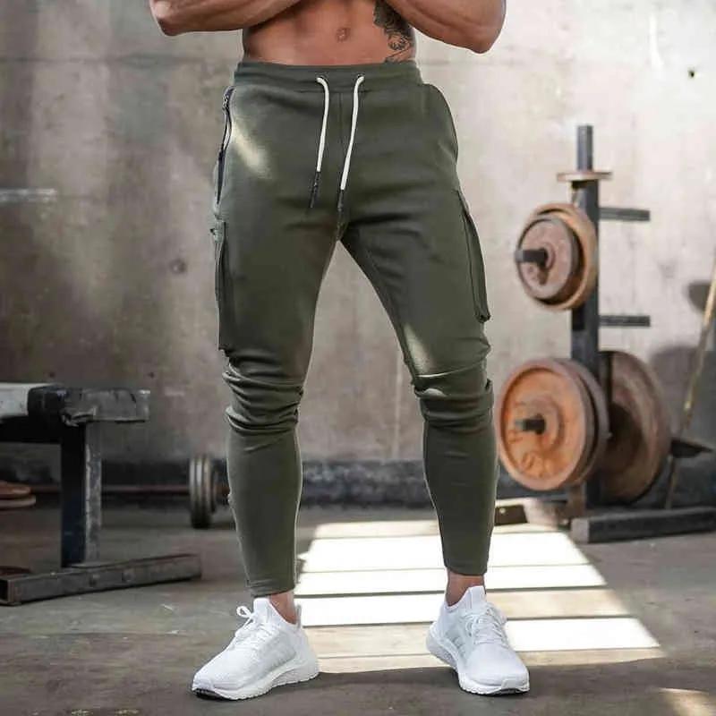 Joggers Sweetpants Men Calças magras casuais calças de vários bolsos de rastreamento masculino Treinamento de fitness de ginástica Esporte de pisca de panteda G220713