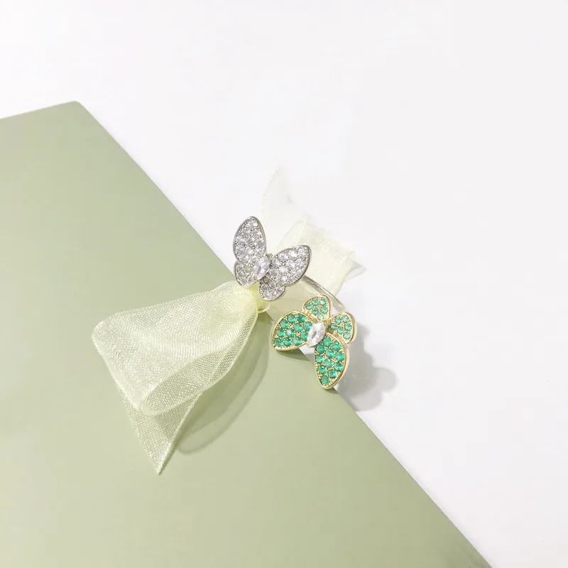 ヨーロッパアメリカのファッションリングレディーマシュット設定カラーダイヤモンド18kゴールドフィンガーリング間の2つの蝶4色296J