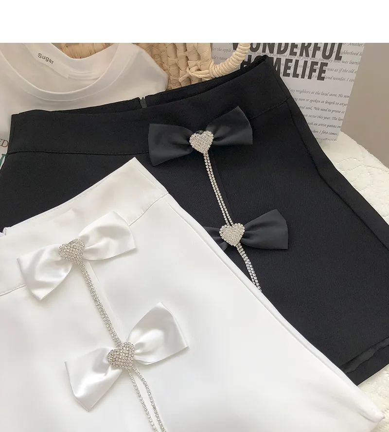 Shorts kjolar kvinnor vit svart diamant båge a-line all-match sashes sommarknapp 220427