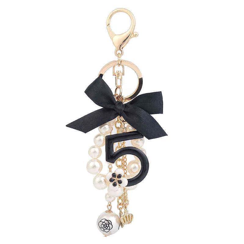 Numer 5 Camellia Torba Wisiorek Dla Kobiety Luksusowa Biżuteria Łuk Car Keyring Bowknot Camellia Pearl Breloki Torba Dekoracja AA220318