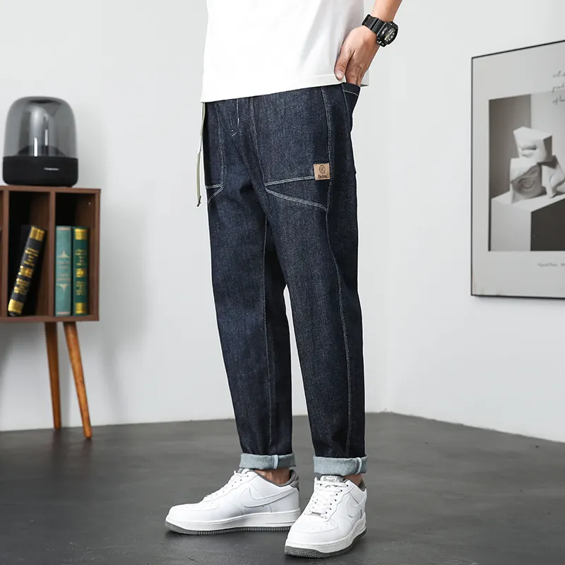 Jeans blu scuro da uomo elasticizzati vestibilità ampia gamba larga primavera estate pantaloni harem casual vita elastica streetwear patchwork include cintura CX220401