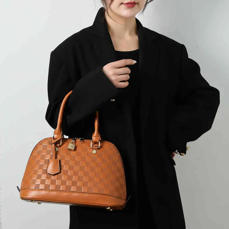 Dames mode marque de luxe marée sac en gros femmes coquille 2022 nouvelle pièce lumière en relief unique épaule sac à main