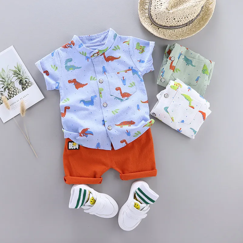 Söt baby pojke kläder sommaren set tecknad dinosaurie tryck kort ärmskjorta + byxor för 1 2 3 4 år barn småbarn outfit 220516gx