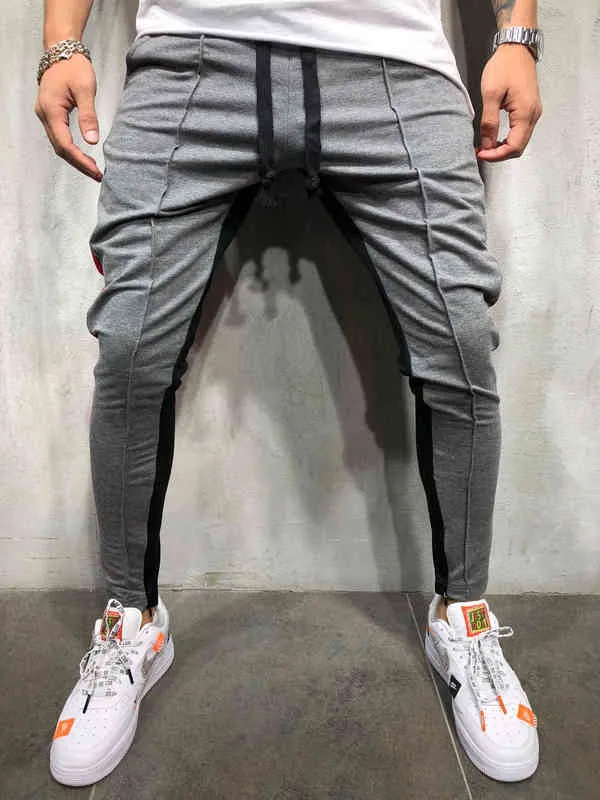 Qnpqyx streetwearne sprężystości przyczynowe Spodnie sportowe Mężczyźni ślady czarno białe męskie spodnie dresowe hip -hopowe dla mężczyzn joggers G220713