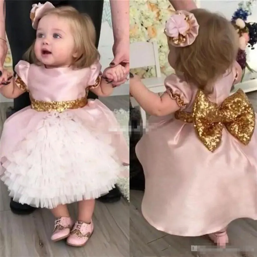 Cute Pink Bow Wedding Flower Girls Dresses Toddler Baby First Communication Dresses With Gold Sequins Tiered Tea Length Party Ball Gown Kids