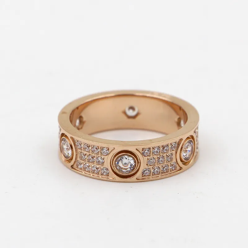 Anelli amanti degli anelli d'amore in acciaio al titanio 316L di alta qualità Anelli a fascia donne e uomini in larghezza 6 mm con tre linee di diamanti Jewelry303r
