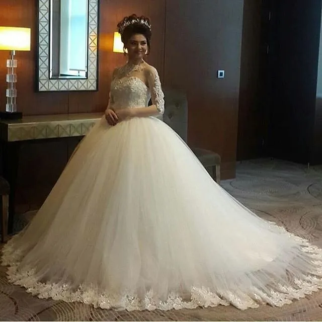 2017 Sexy Arabic Ball Gown Wedding Dresses Jewel Neck Long Sleeves Lace Appliques Beaded Bling Puffy Court Train Plus Size Bridal Gowns