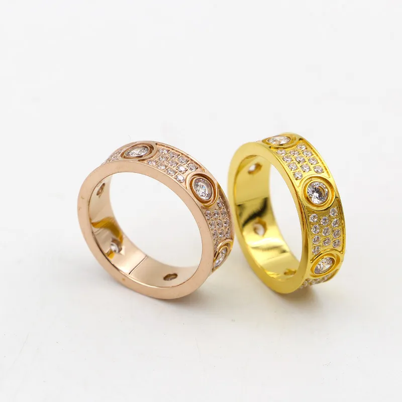 Anelli amanti degli anelli d'amore in acciaio al titanio 316L di alta qualità Anelli a fascia donne e uomini in larghezza 6 mm con tre linee di diamanti Jewelry303r