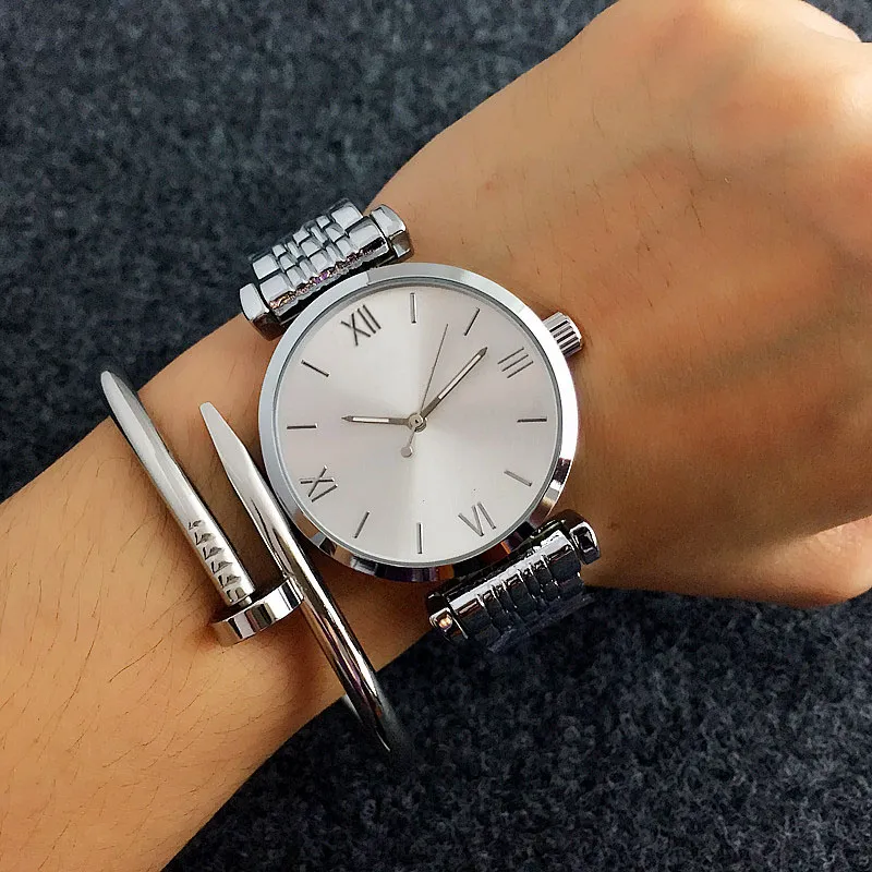 Montres de marque de mode femmes fille style bande d'acier en métal montre-bracelet à Quartz AR01