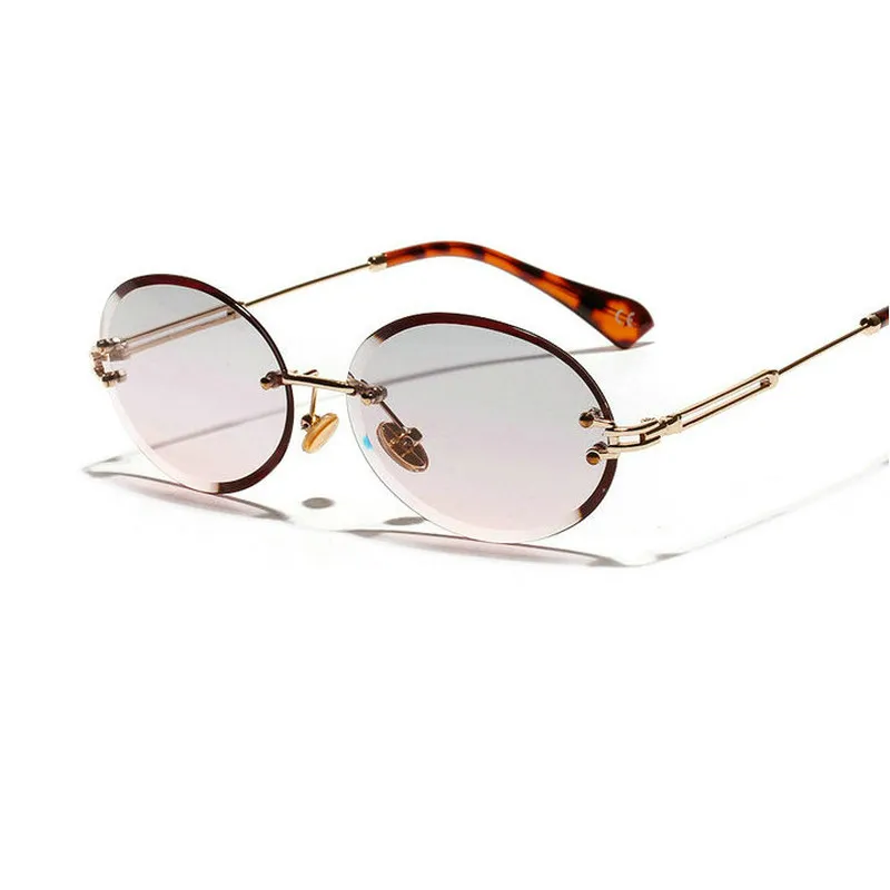 Diamentowe wycięte retro owalne okulary przeciwsłoneczne kobiety krystalicznie teksturowane okulary bez granic JW266D