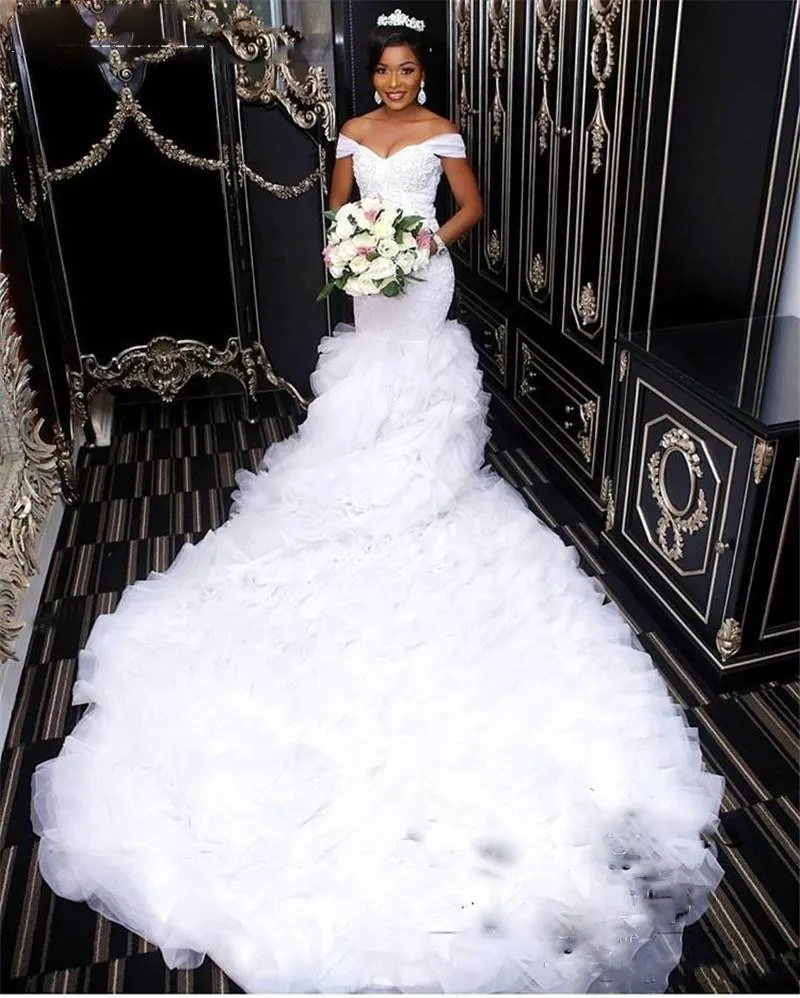 2020 Modern Hot Sale Mermaid Wedding Dresses African Off Shoulder Tiered Ruffles Organza Lace Appliques Beaded Cathedral Train Bridal Gowns