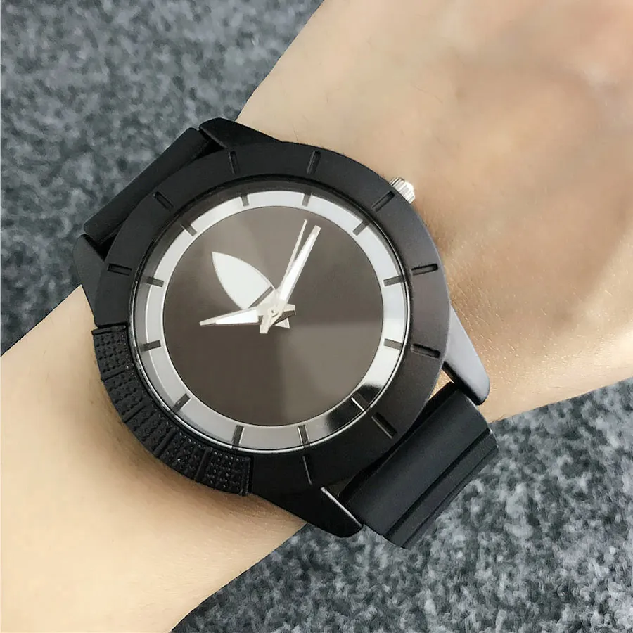 Mode Clover Marke Armbanduhren für Frauen Männer Unisex mit 3 Blätter Blatt Stil Zifferblatt Silikonband Quarzuhr AD20241t
