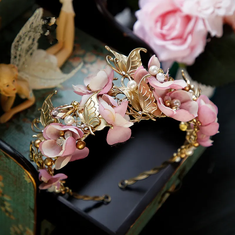 https://www.dhresource.com/webp/m/0x0s/f2-albu-g7-M00-B7-97-rBVaSVtW5EmAMYjPAAKSKNtt4O0466.jpg/kroean-baroque-beach-wedding-bridal-pink-flower-gold-butterfly-crown-pearls-headbands-party-tiara-hair-accessories-headpieces.jpg