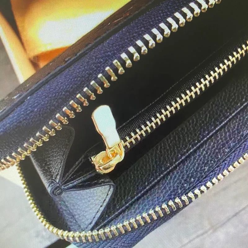 M60171 Toppkvalitet präglad empreinte läderclemence zippy plånbok för kvinnor lång blixtlås plånbok zip korthållare purses wal2690