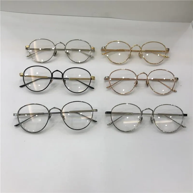 Novos vidros ópticos de estilista de moda 0009 Metal Round Frame Retro Modern Style Lente transparente pode ser lentes transparentes de prescrição2769