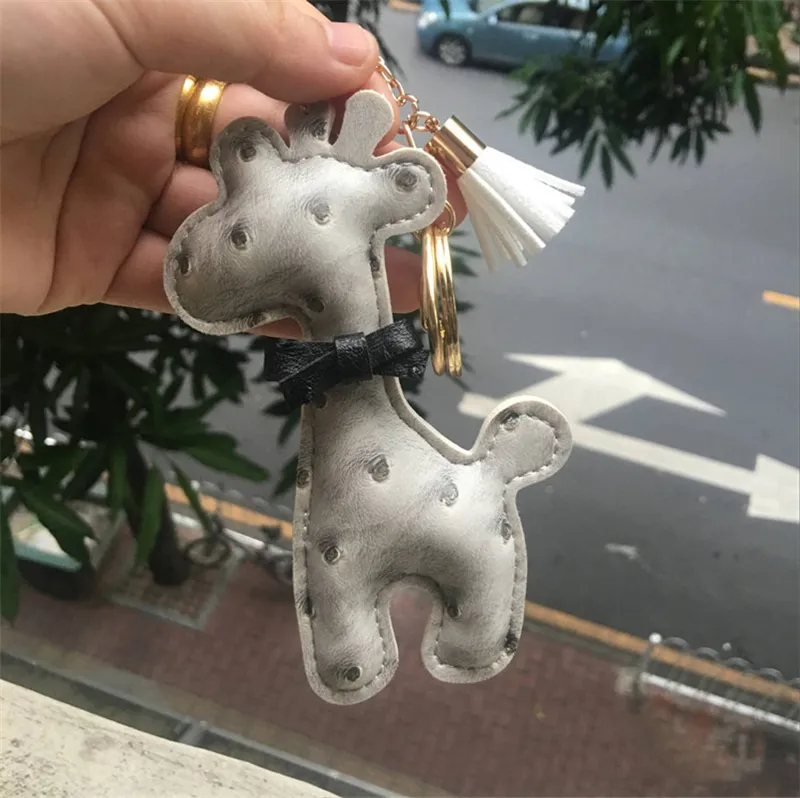 Chaves de couro PU Chaves de desenho animado projetos de animais Padrão padrão girafa Keyring Chave -chave do anel da corrente Mulheres BACA PENENTE JOWE301F