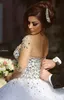 Spring 2021 Luxury Crystal Wedding Dresses Bridal Gowns With Crystal Beads A Line Sheer Illusion Crew Neck Long Sleeves Floor Length Arabic