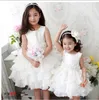 Prinsessan vit juvel nacke blomma flicka klänningar Ruffles a-line satin och organza billig tjej klänning för bröllopsfestklänningar med blommor