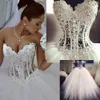 Abiti da sposa di lusso con perline di perle di pizzo Abiti da sposa arabi unici Collo a cuore con zip sul retro Abiti da sposa principessa in tulle bianco