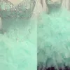 Nya Quinceanera -klänningar 2015 i 15 år med älsklingspärlor Kristaller Backless Ruffles Bollklänning Golvlängd Organza Mint Gree294Z